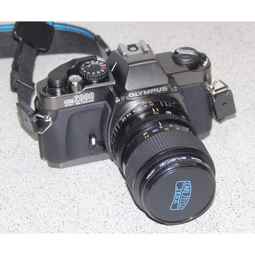 655 - An Olympus OM2000 camera with Zeiss F=35-70mm 1:3.5-4.8 lens, with case and an Olympus OM10 camera b... 