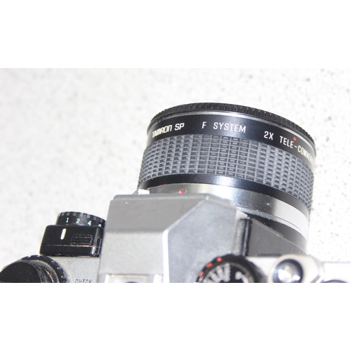 655 - An Olympus OM2000 camera with Zeiss F=35-70mm 1:3.5-4.8 lens, with case and an Olympus OM10 camera b... 