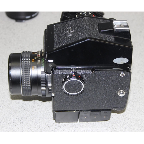 657 - A Mamiya M645 J camera with Mamiya Sekor 1:2.8 f=80mm lens, a further 1:2.8 f=45mm lens, in canvas c... 