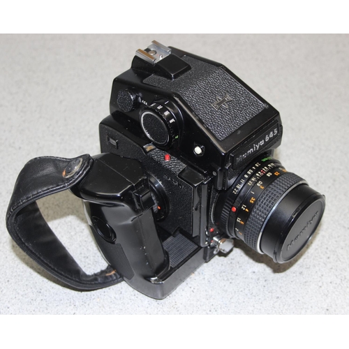 657 - A Mamiya M645 J camera with Mamiya Sekor 1:2.8 f=80mm lens, a further 1:2.8 f=45mm lens, in canvas c... 