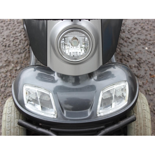 701 - Kymco Foru mobility scooter in silver, with keys, battery and charger