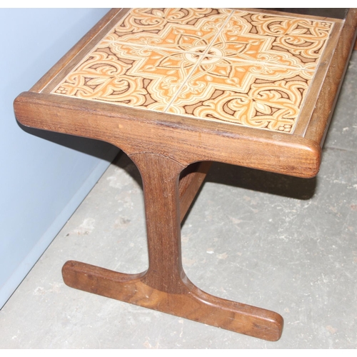 75 - A retro G-Plan teak coffee table with retro tiles and smoked glass, approx 121cm wide x 49cm deep x ... 