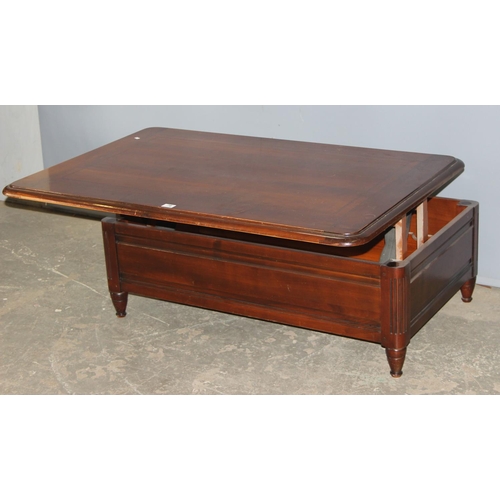 78 - An unusual Richelieu mahogany coffee table with rising top and storage under, approx 129cm wide x 85... 