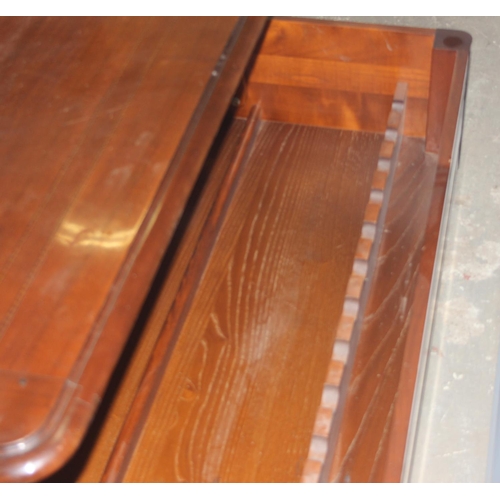 78 - An unusual Richelieu mahogany coffee table with rising top and storage under, approx 129cm wide x 85... 