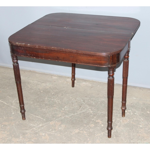 82 - An antique folding mahogany tea table with reeded legs, approx 88cm wide x 88cm deep x 75cm tall