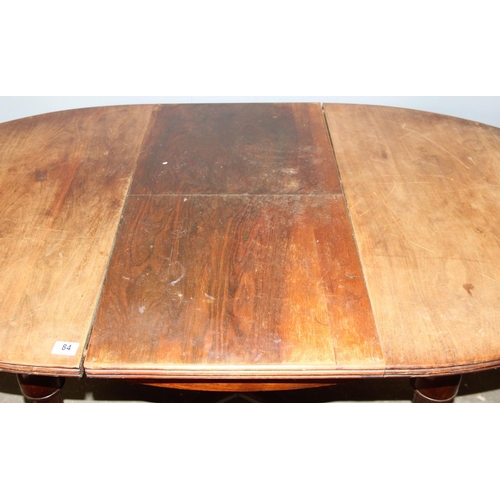 84 - An antique French oval table with extending leaf, approx 122cm wide