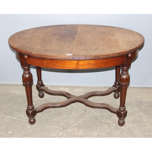 84 - An antique French oval table with extending leaf, approx 122cm wide