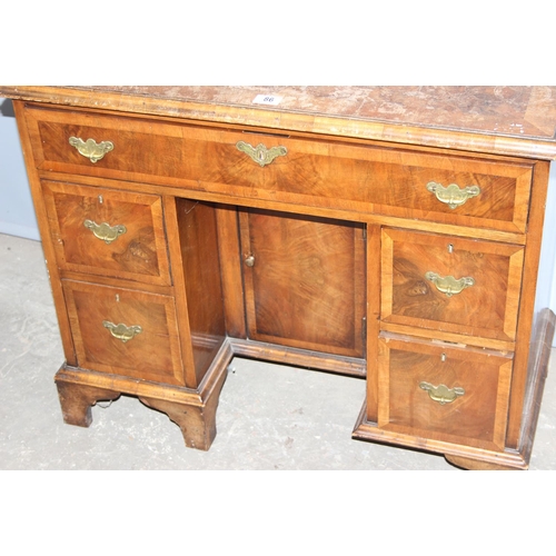 86 - A Georgian style knee-hole desk with one long over 2 banks of 2 short drawers and a cupboard, brass ... 