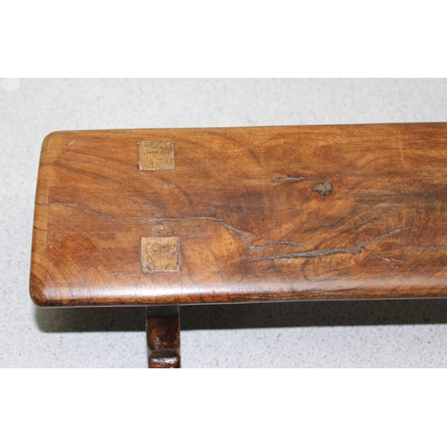 67 - A long antique low wooden foot stool or rest, approx 88cm wide