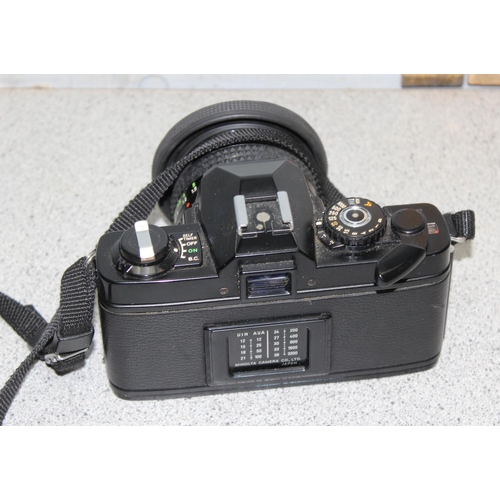 665 - Minolta XG9 camera with spare lens in carry case