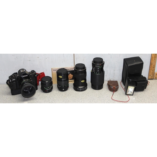 668 - Cannon A-1 35mm manual camera body with battery pack, 5 interchangeable lenses to include Canon FD 5... 