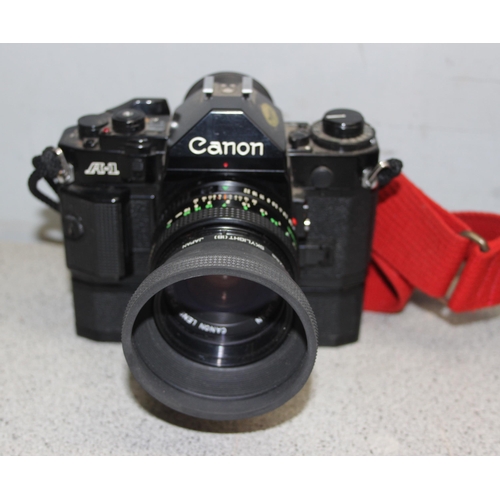 668 - Cannon A-1 35mm manual camera body with battery pack, 5 interchangeable lenses to include Canon FD 5... 