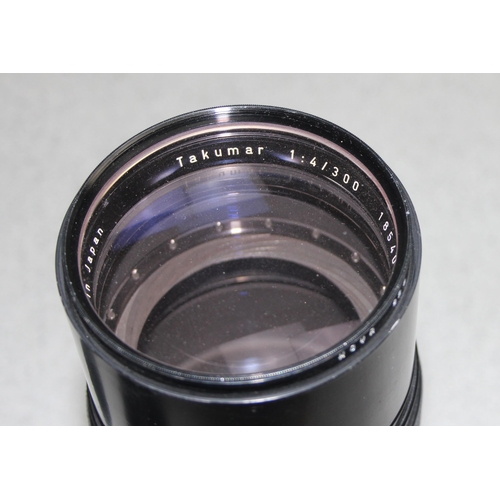 669 - Pentax Super Takumar 300 1:4 camera lens with original carry case