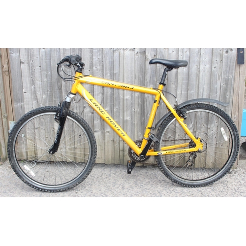 700 - Yellow Land Rover mountain bike