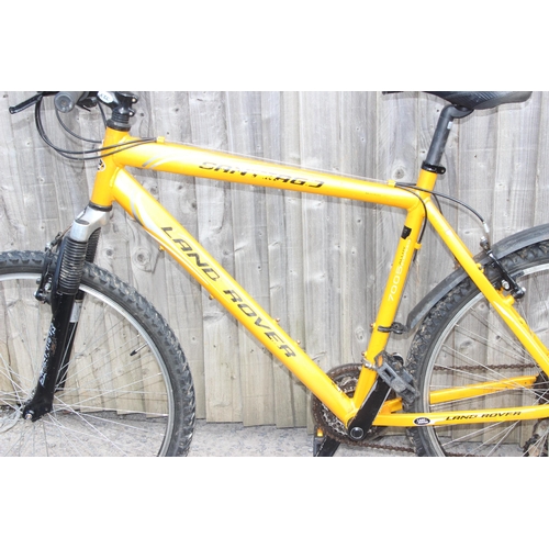 700 - Yellow Land Rover mountain bike