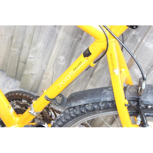 700 - Yellow Land Rover mountain bike