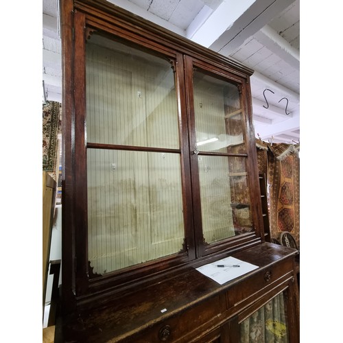 22 - An unusual antique oak display cabinet with 2 pairs of glazed doors and 2 slim drawers, approx 143cm... 