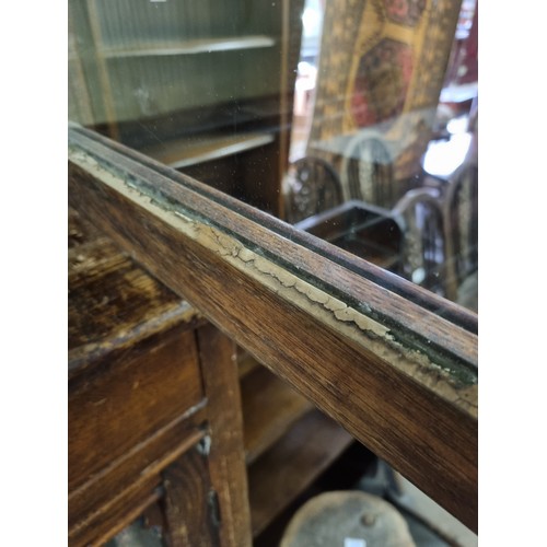 22 - An unusual antique oak display cabinet with 2 pairs of glazed doors and 2 slim drawers, approx 143cm... 