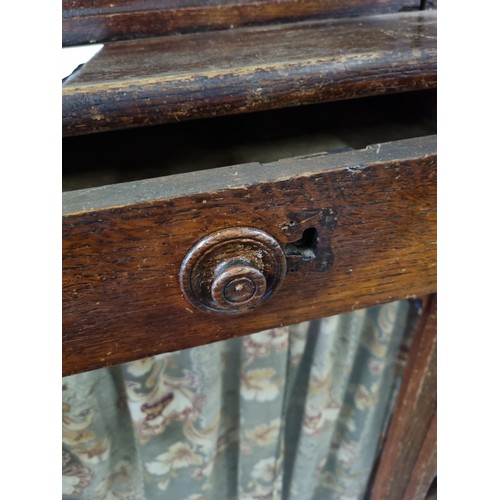 22 - An unusual antique oak display cabinet with 2 pairs of glazed doors and 2 slim drawers, approx 143cm... 