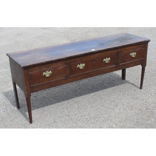 1 - An 18th century oak/ elm sideboard with 3 drawers, brass handles on turned wooden legs, approx 170cm... 