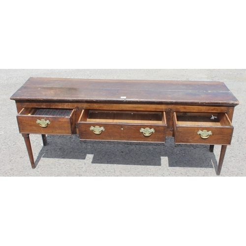 1 - An 18th century oak/ elm sideboard with 3 drawers, brass handles on turned wooden legs, approx 170cm... 