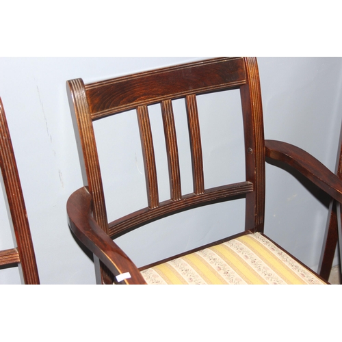 41 - A set of 4 antique style mahogany dining chairs with spade legs, 3 dining and one carver