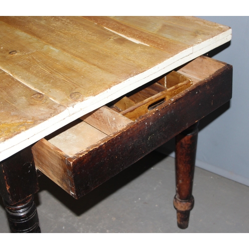 37 - An antique stained pine farmhouse kitchen table with turned legs and drawer, approx 107cm wide x 78c... 