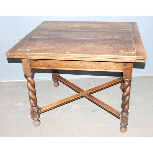 36 - A vintage extending oak dining table with barleytwist legs, approx 92cm wide x 99cm deep x 75cm tall... 