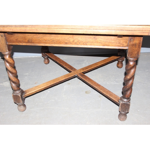 36 - A vintage extending oak dining table with barleytwist legs, approx 92cm wide x 99cm deep x 75cm tall... 