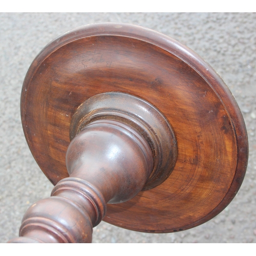 31 - An antique mahogany jardinière stand with turned pedestal and tripod base, approx 30cm in diameter x... 