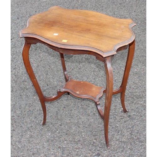 33 - An Edwardian mahogany lamp table with shaped top, approx 64cm wide x 42cm deep x 72cm tall