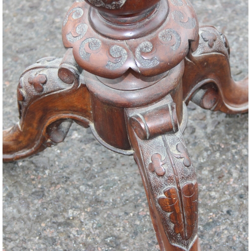 47 - A 19th century walnut wine table with profusely carved tripod base, approx 42cm wide x 72cm tall