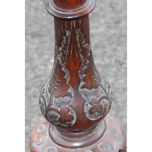 47 - A 19th century walnut wine table with profusely carved tripod base, approx 42cm wide x 72cm tall