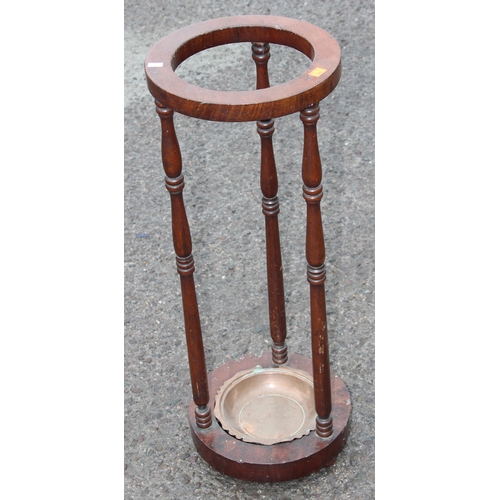 30 - A vintage mahogany stick or umbrella stand with turned supports, approx 28cm wide x 75cm tall