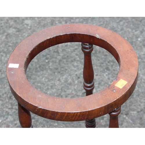 30 - A vintage mahogany stick or umbrella stand with turned supports, approx 28cm wide x 75cm tall