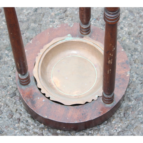 30 - A vintage mahogany stick or umbrella stand with turned supports, approx 28cm wide x 75cm tall