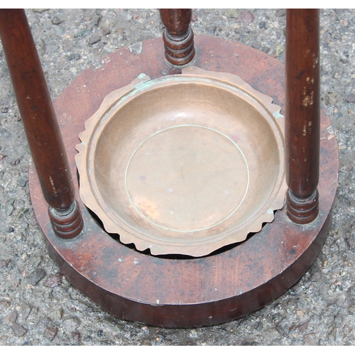 30 - A vintage mahogany stick or umbrella stand with turned supports, approx 28cm wide x 75cm tall