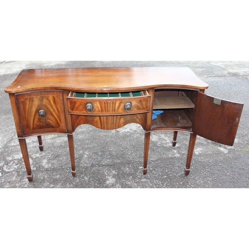 34 - An antique style flame mahogany serpentine sideboard with a central drawer flanked by 2 cupboards, a... 