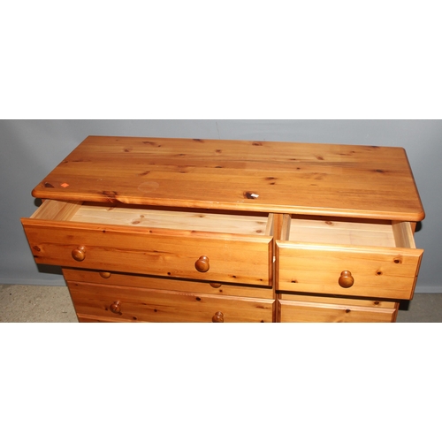 16 - A modern pine 8 drawer chest of drawers, approx 118cm wide x 44cm deep x 80cm tall