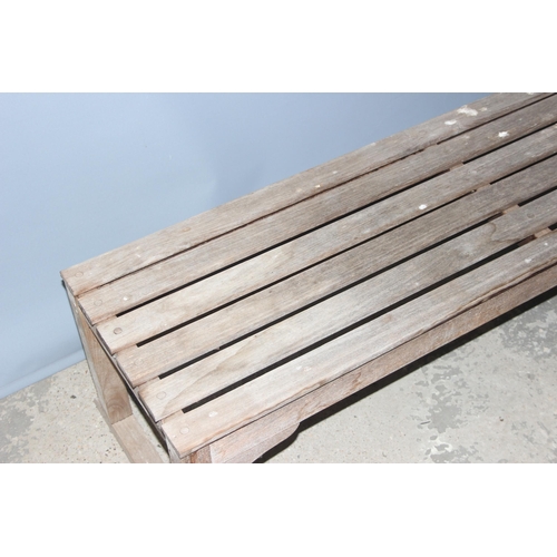 301 - A weathered slatted teak garden bench by Barlow Tyrie of Braintree, approx 149cm wide x 56cm deep x ... 