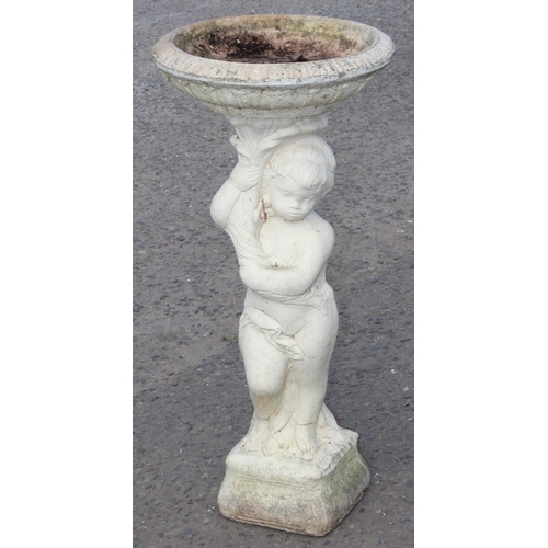 305 - A white painted concrete garden birdbath formed as a cherub, approx 88cm tall