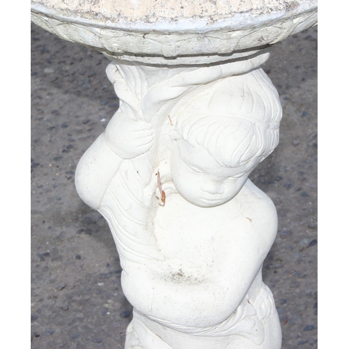 305 - A white painted concrete garden birdbath formed as a cherub, approx 88cm tall