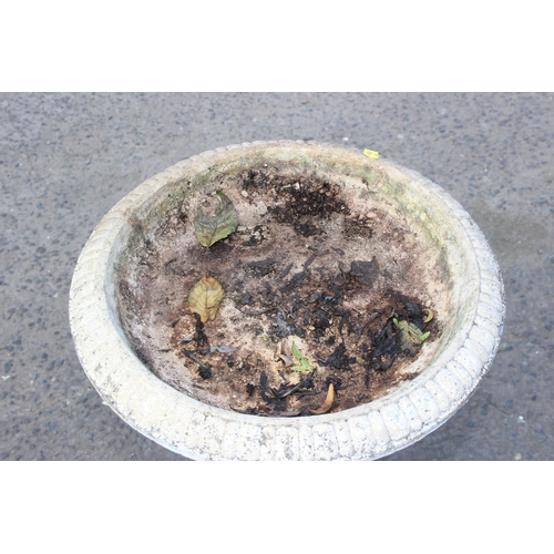 305 - A white painted concrete garden birdbath formed as a cherub, approx 88cm tall