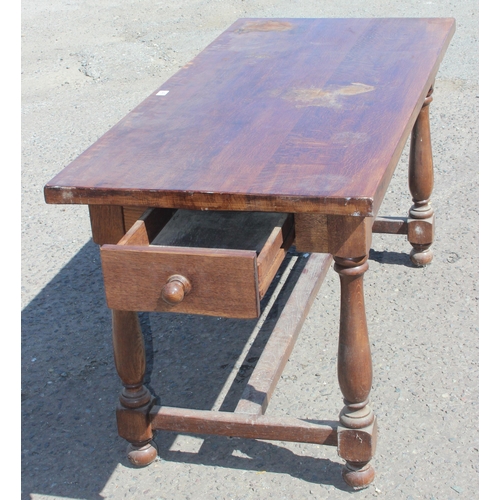 49 - A vintage oak refectory table with turned legs and 2 drawers, approx 152cm wide x 70cm deep x 78cm t... 