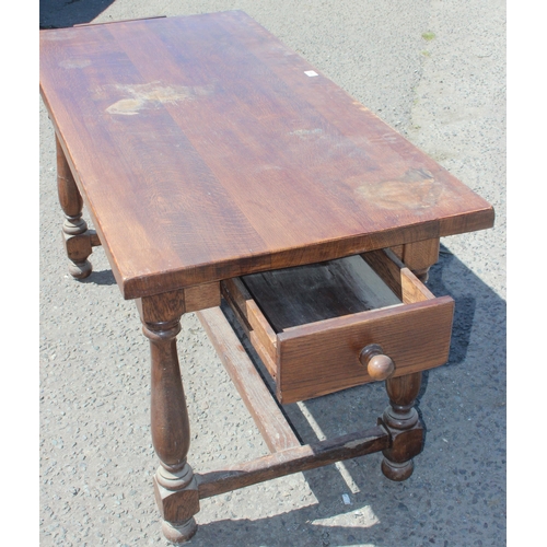 49 - A vintage oak refectory table with turned legs and 2 drawers, approx 152cm wide x 70cm deep x 78cm t... 