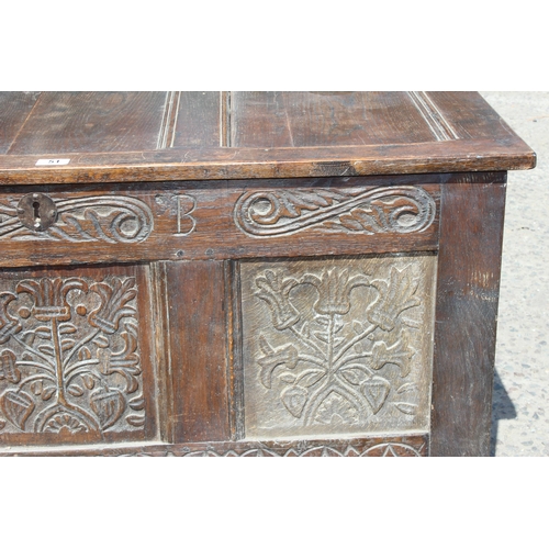 51 - An 18th century oak coffer with carved details, approx 120cm wide x 54cm deep x 71cm tall