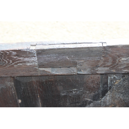 51 - An 18th century oak coffer with carved details, approx 120cm wide x 54cm deep x 71cm tall