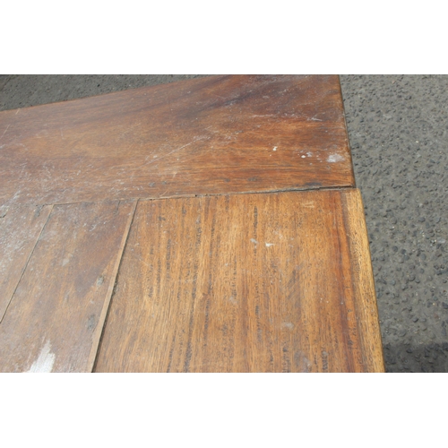 53 - A hardwood dining table and 2 matching benches, approx 180cm wide x 93cm deep x 75cm tall