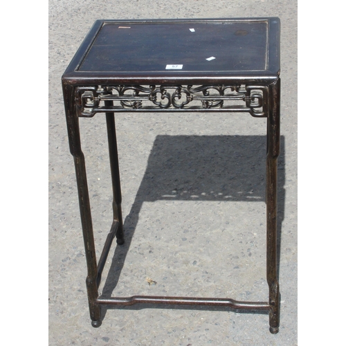 57 - An antique Oriental hardwood table with fretwork carved edging, approx 50cm wide x 40cm deep x 76cm ... 