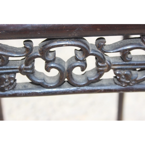 57 - An antique Oriental hardwood table with fretwork carved edging, approx 50cm wide x 40cm deep x 76cm ... 